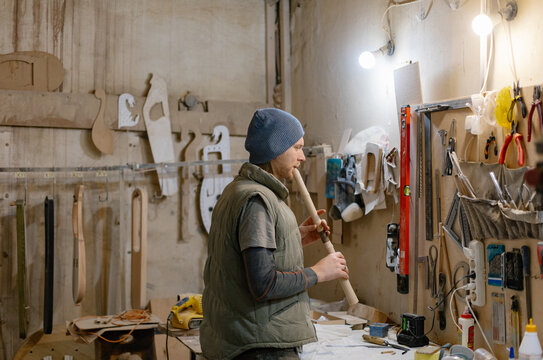 guitar master tuning the instrument