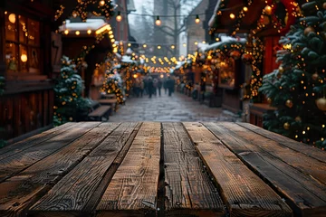 Meubelstickers Empty wood table with blur christmas market background with copy space © krishnendu