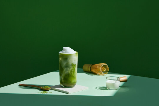 Organic green matcha tea with milk and accessories for making