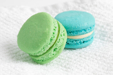 Meringue macaroon cookies on a white terrycloth background
