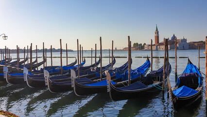 Group of gondolas moored by Saint Mark square in city of Venice, Veneto, Northern Italy, Europe....