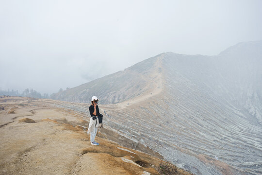 Female Travel Walking Over Mountains Trail Misty Landscape at Dawn