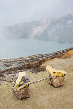 Stack of sulfur ore rocks, open mining in volcano crater