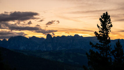 Dolomites, Italy. Sunset backlighting of the peaks of the Dolomites in the summer time