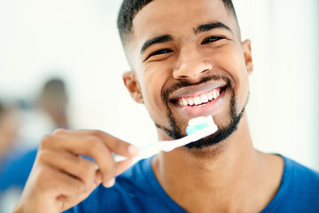 Happy man, portrait and teeth with toothbrush for dental care, hygiene or morning routine at home. Face of young male person with big smile or toothpaste for clean mouth, oral or gum health at house