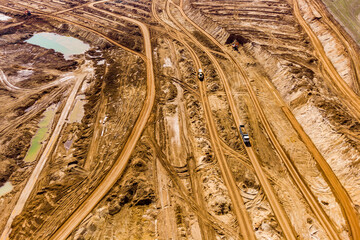 Freight traffic in a sand quarry, a view of mining from a high altitude