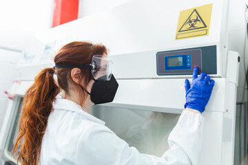 Scientist wearing Personal protective equipment in laboratory