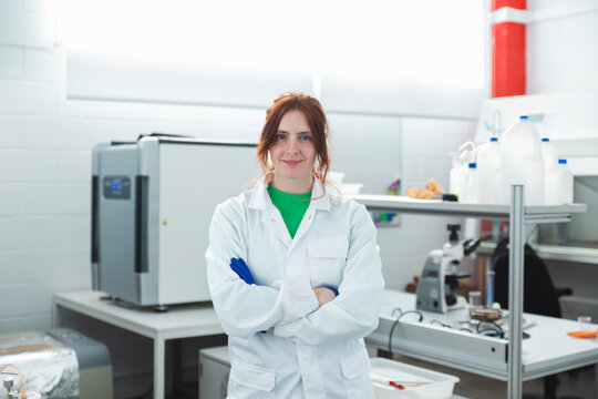 Portrait confident Female scientist in laboratory