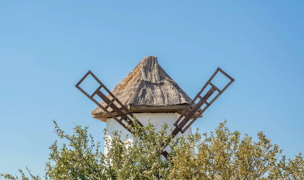 The roof of an ancient windmill against the sky
