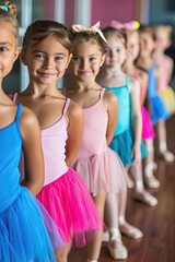 A group of young girls are lined up in their ballet costumes