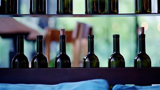 Wine bottles on shelves at a restaurant
