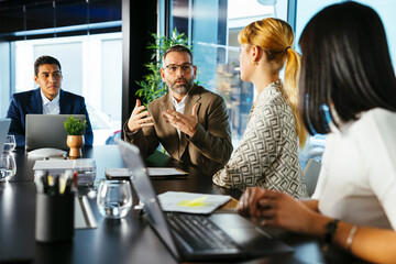 Business advisors discussing strategy in office