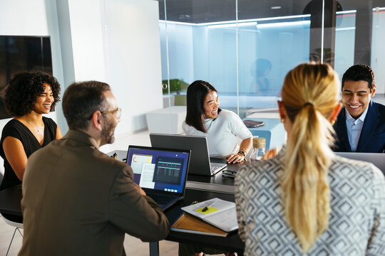 Group of diverse business advisors discussing strategy in office