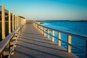 Obraz premium View on Rio Formosa wooden boardwalk near Faro in the Algarve, Portugal