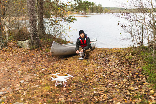 Man flying drone in nature