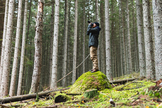 Photographer taking pictures in wilderness adventure