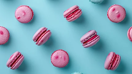 Rolgordijnen Pink macarons on blue background © MiguelAngel