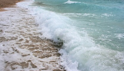 waves on the pebble beach of Baska, island Krk, Croatia