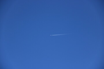 airplane flying in blue sky