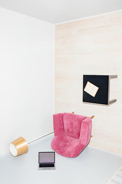 A fantasy make-up with a laptop on the wall in a room upside down