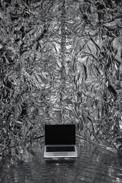 A conceptual mockup with a laptop in a fully metallized space