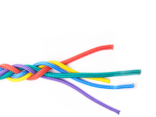 Ties, rope and connection of color in knot or flat lay braid on white background in studio for collaboration. Rainbow, cord and above abstract unity of society with link in cooperation of community