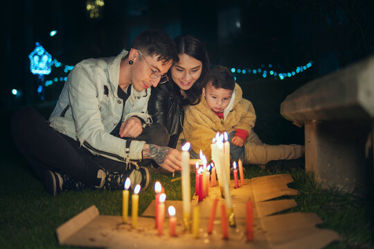 Family lighting candles