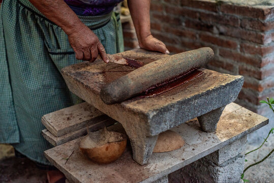 Anonymous Zapotec woman making chocolate