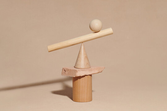 Different geometric shaped objects spheres and pyramid balancing