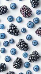 A close-up of blackberries and blueberries creates a vibrant and textured pattern