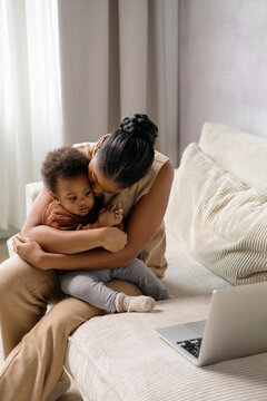 Interactive Learning: Mother and Baby with laptop at home