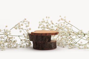 Flower twig, Wood stump platform podium on light beige background. Minimal empty display product presentation scene.