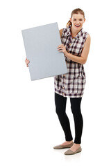 Portrait, happy woman and board in studio with smile, mock up and advertising. Happiness, marketing and face of isolated female person by white background for sign with sale, branding and info poster