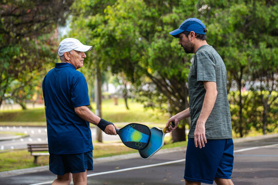 Men clashing rackets