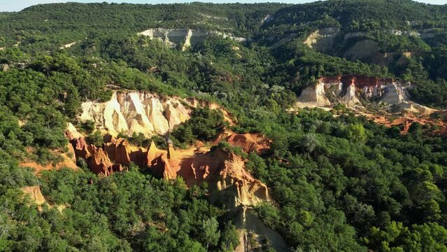 Aerial footage of Red sands and abstract Rustrel canyon moher cliffs landscape. Provencal Colorado near Roussillon,in the Vaucluse department - Southern France.