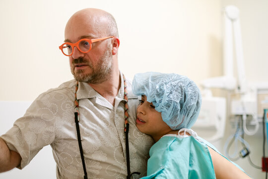 Dad comforting son in hospital