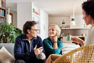 Couple talking during visit financial advisor at home