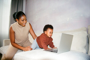 Mother and Child Enjoying Laptop Time at home