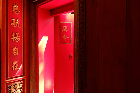 Sunlight on the red wall at Chinese Temple