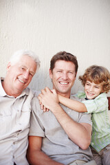 Father, kid and grandfather hug in portrait on a porch with love, support and bonding on vacation...