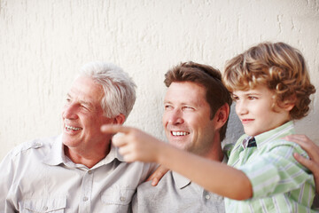 Pointing, family and grandpa, dad and child in home for bonding, happy relationship and...