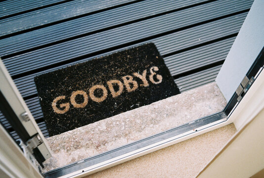 A doormat that says "goodbye"