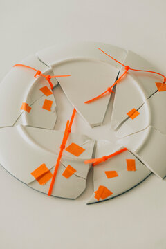 Broken porcelain plate with bonds