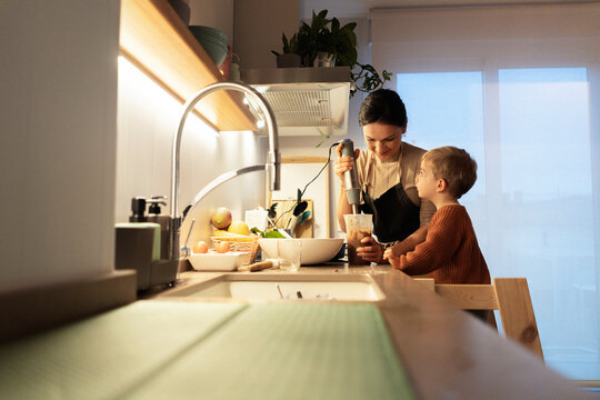 family cooking in the home kitchen