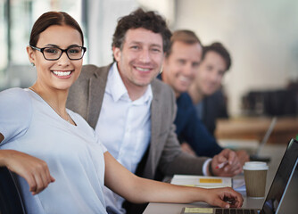 Happy woman, laptop and glasses in meeting with business parters at office desk for strategy planning. Female person, portrait and collaboration in workshop for career, brainstorming and seminar.