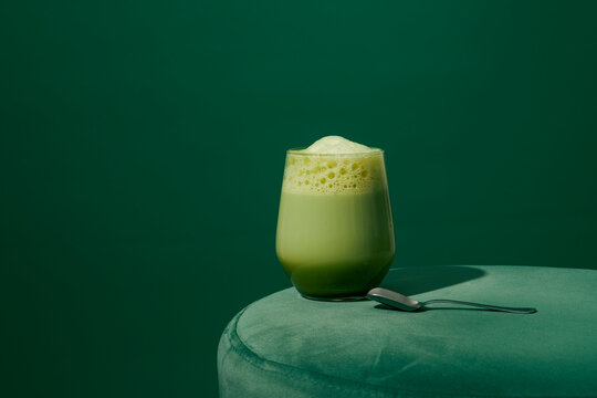 silver spoon and iced matcha latte