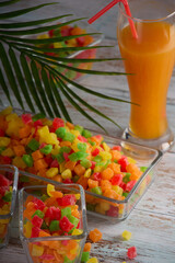 Vertical photo with the image of a glass with delicious freshly squeezed juice standing on the...