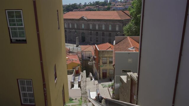 Moving staircase Monte dos Judeus ascends to top of hill in Porto, Portugal. Escadas Monte dos Judeus mechanised pedestrian walkways connect Palacio de Cristal hill through Miragaia to Virtudes hill. 