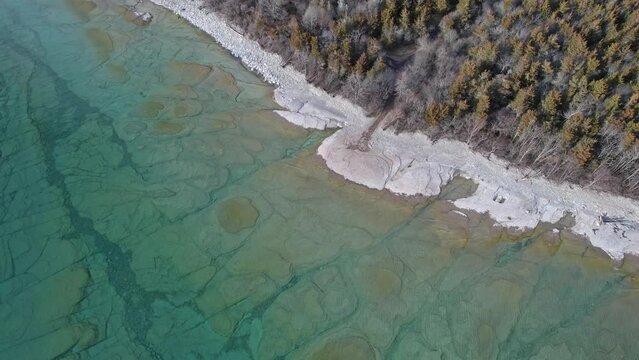Prince Edward County Beach in Ontario aerial view. Lake Ontario in Canada. Prince Edward County, Point Petre Beach irregular headland or littoral made of limestone cliffs.