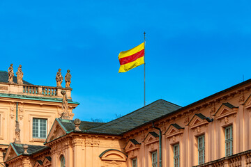 Fototapeta na wymiar The Baden flag on the baroque style castle in Rastatt city, Schwarzwald, Baden Württemberg, Germany, Europe